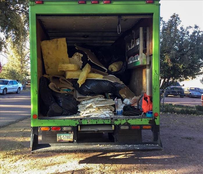 Demolition debris in back of truck. 