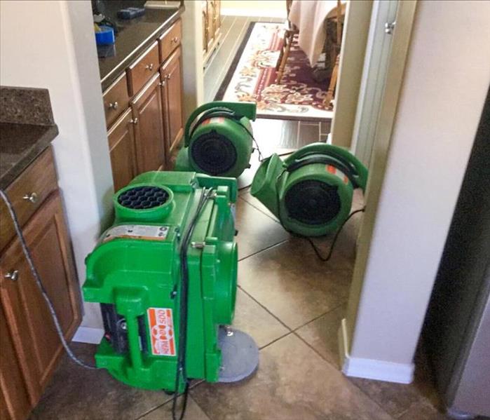 Drying equipment set up and running in bathroom.