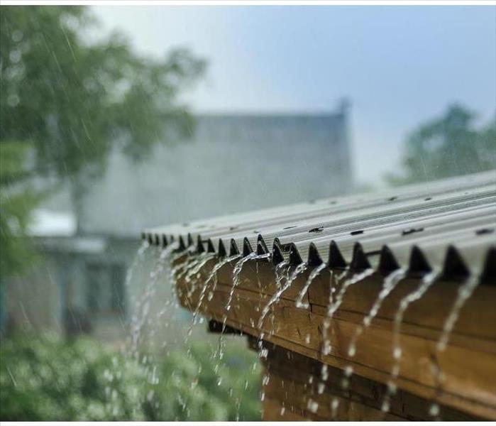 rain flows down from a roof down